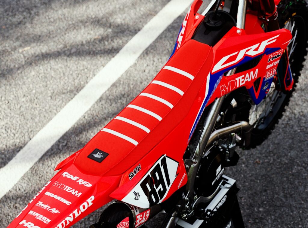 Red and white Honda CRF seatcover