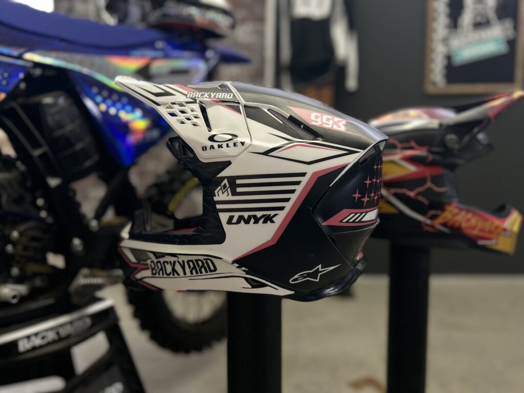 Alpinestars SM8 helmetwrap with white, black and coral accents
